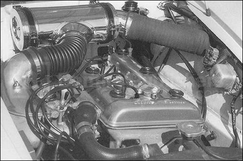Fig. 5-2. One of the hottest-and fussiest-of all Alfa engines was Giulietta Veloce powerplant. Twin Weber carburetors demanded a separate air cleaner, hung from the bulkhead.