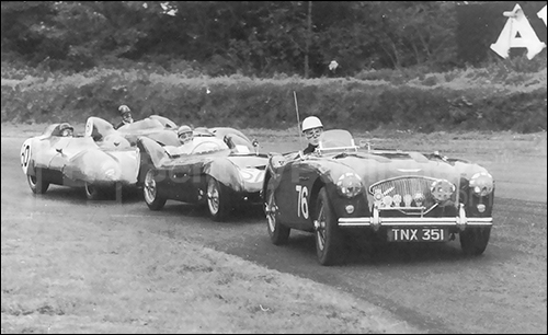 Oulton Park, 1957. Austin-Healey 100-4 is chased by two Lotus Mark 9s, and one Lotus 11.