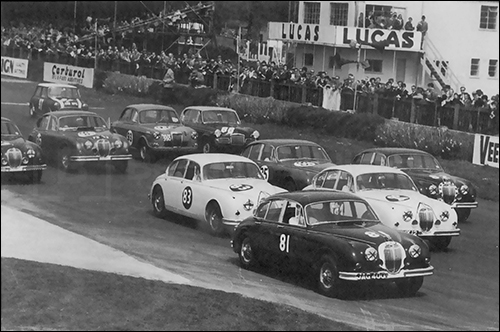 Jaguar Mark II was a popular racer in England and Europe from the beginning. This saloon car race in England is circa 1962.