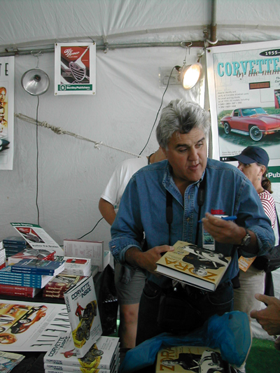 Just another autograph seeker?  Jay Leno brings his copy of Zora Arkus-Duntov: The Legend Behind Corvette to the Bentley Publishers booth at the Monterey Historic Races to get it signed by author Jerry Burton!