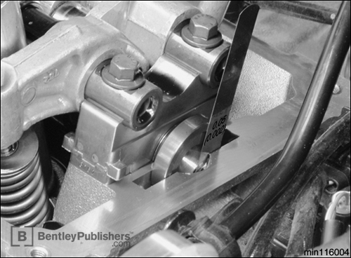 Measuring camshaft axial play.</