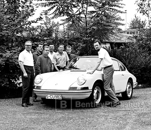 Butzi Porsche (right) poses with the 901, which showed the influence of his designs for the abandoned four-passenger T7.